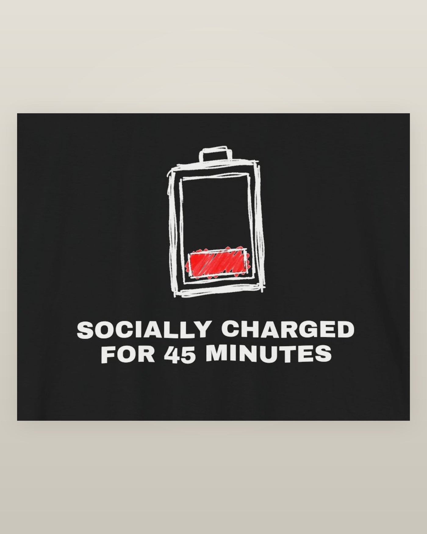 Socially charged for 45 minutes — a battery drained to its last bar, printed on a black cotton t-shirt, close detail of the print
