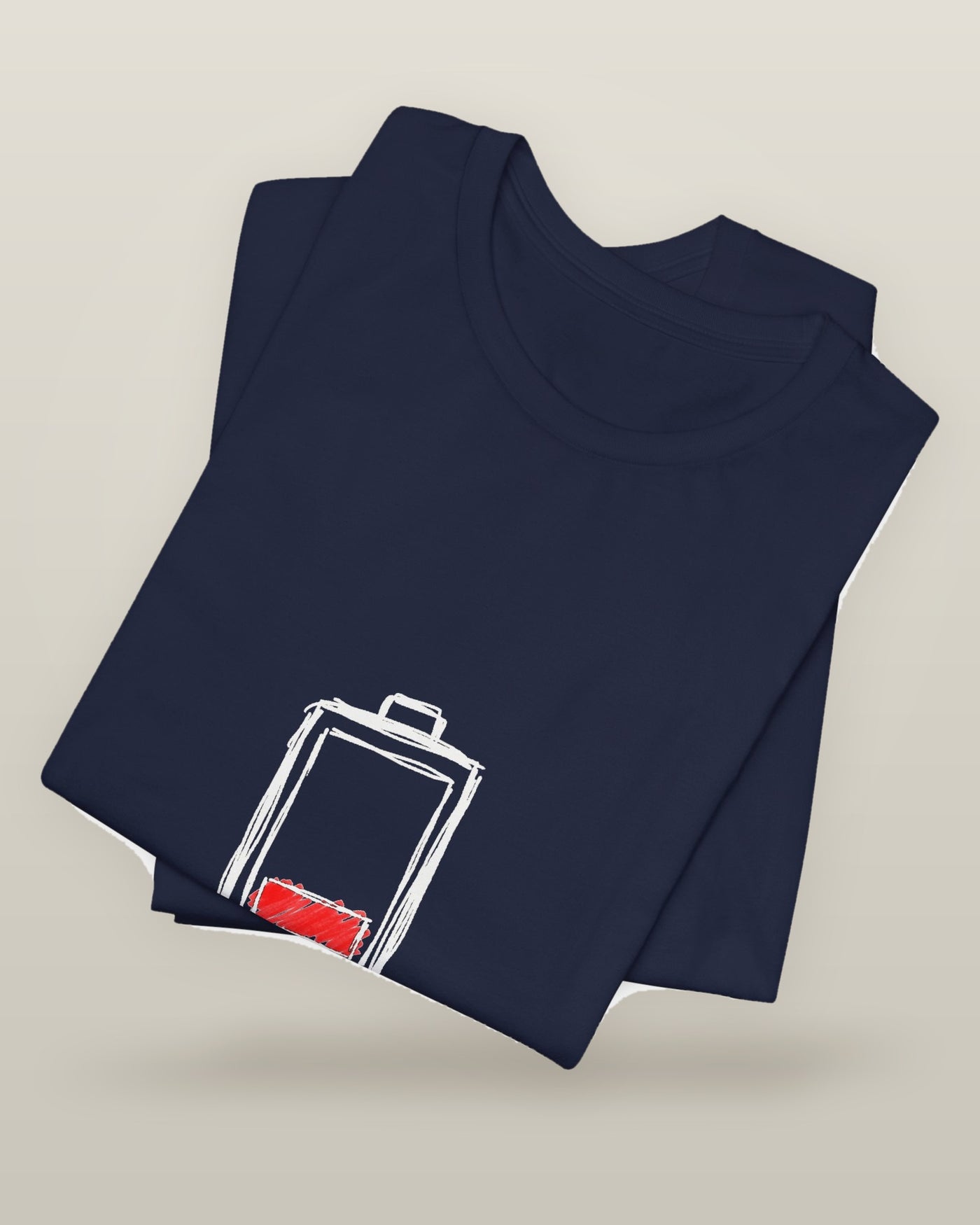 Socially charged for 45 minutes — a battery drained to its last bar, printed on a navy cotton t-shirt, folded