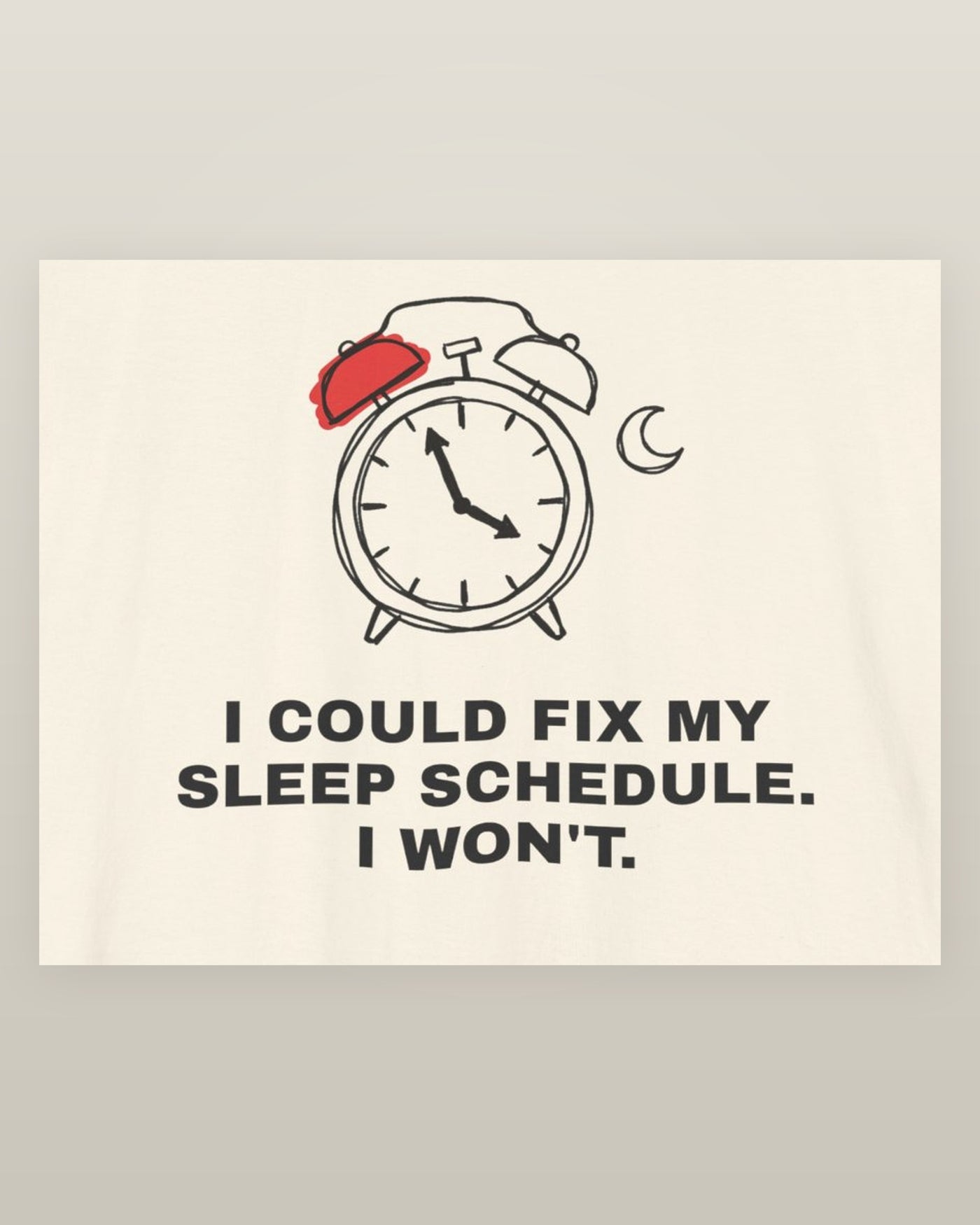 I could fix my sleep schedule. I won't. — an alarm clock at a very late hour beside a crescent moon, printed on a natural cream cotton t-shirt, close detail of the print