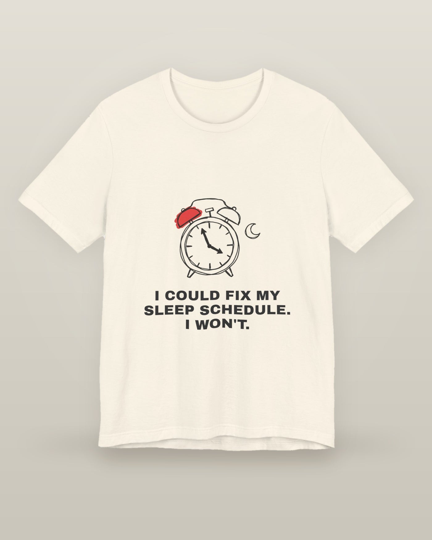 I could fix my sleep schedule. I won't. — an alarm clock at a very late hour beside a crescent moon, printed on a natural cream cotton t-shirt, front view