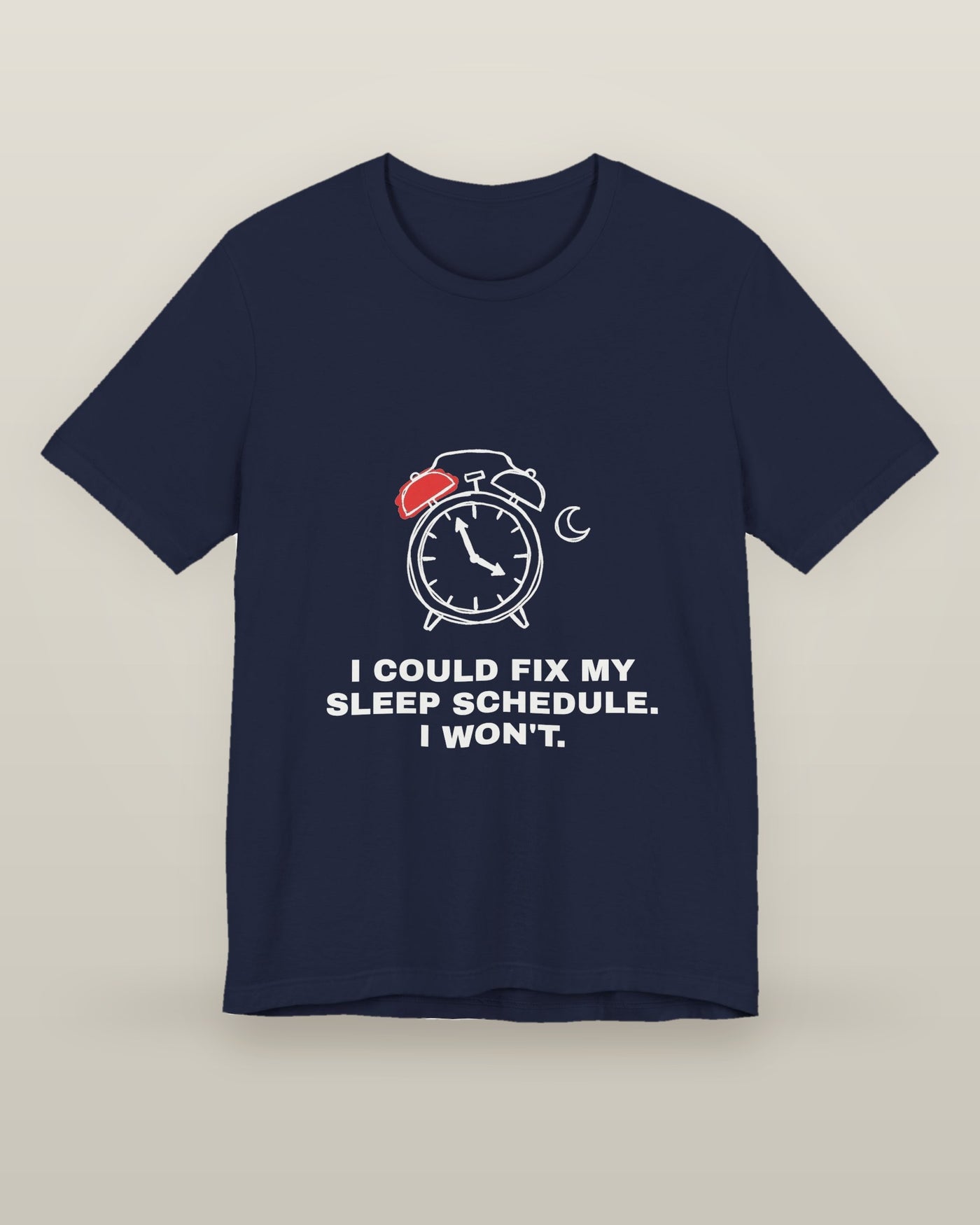 I could fix my sleep schedule. I won't. — an alarm clock at a very late hour beside a crescent moon, printed on a navy cotton t-shirt, front view