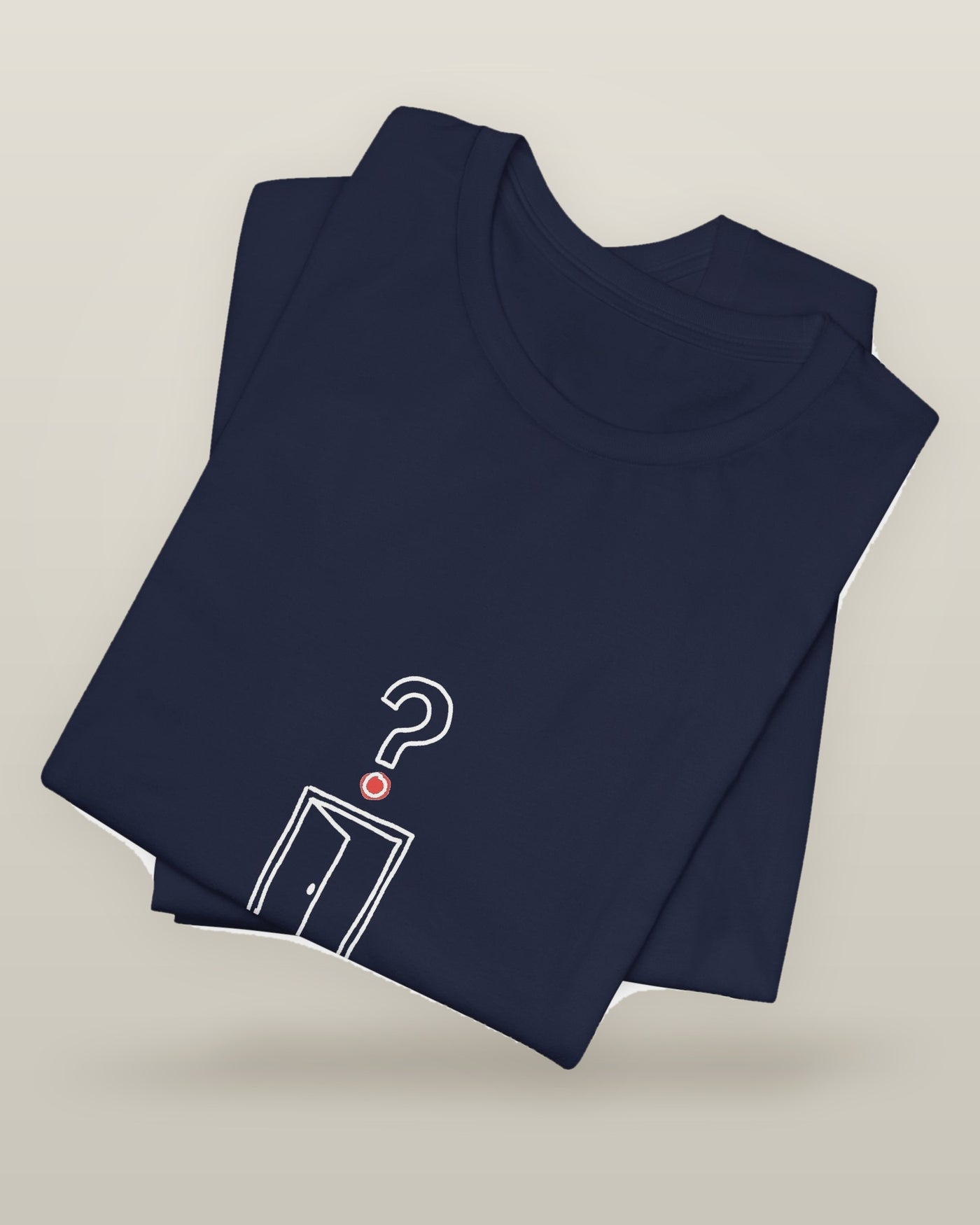 I came, I saw, I forgot why — an empty doorway with a question mark above it, printed on a navy cotton t-shirt, folded