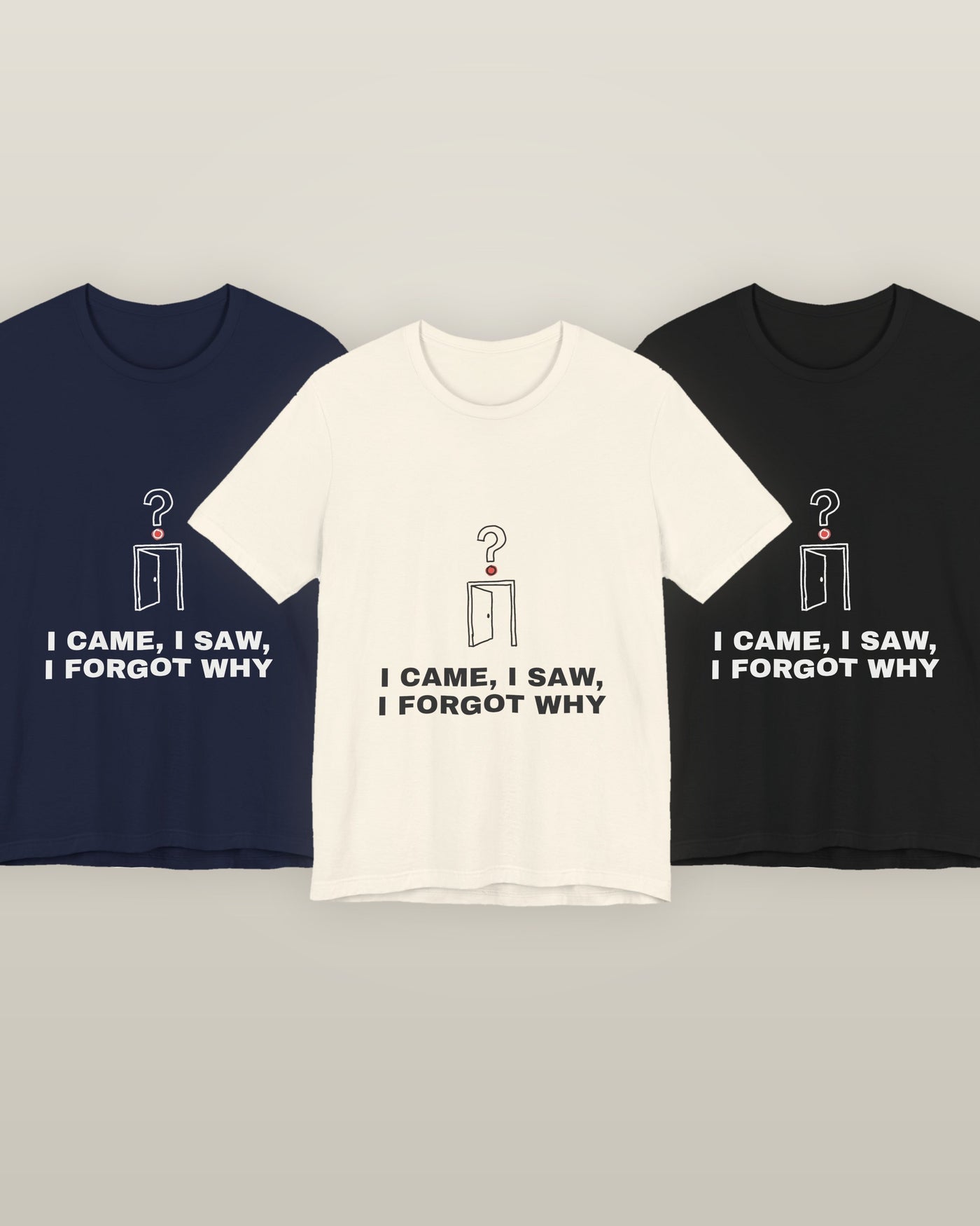 I came, I saw, I forgot why — an empty doorway with a question mark above it, printed on a natural cream, navy and black cotton t-shirt, all three colourways together