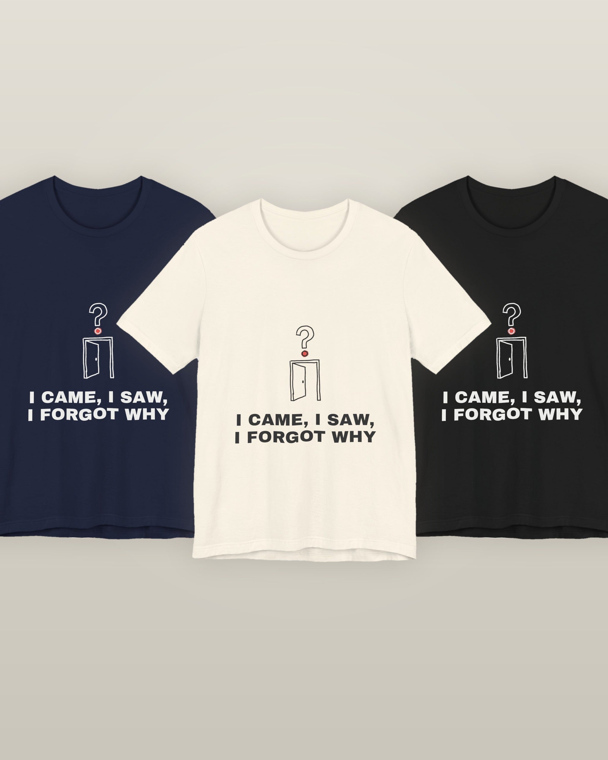 I came, I saw, I forgot why — an empty doorway with a question mark above it, printed on a natural cream, navy and black cotton t-shirt, all three colourways together