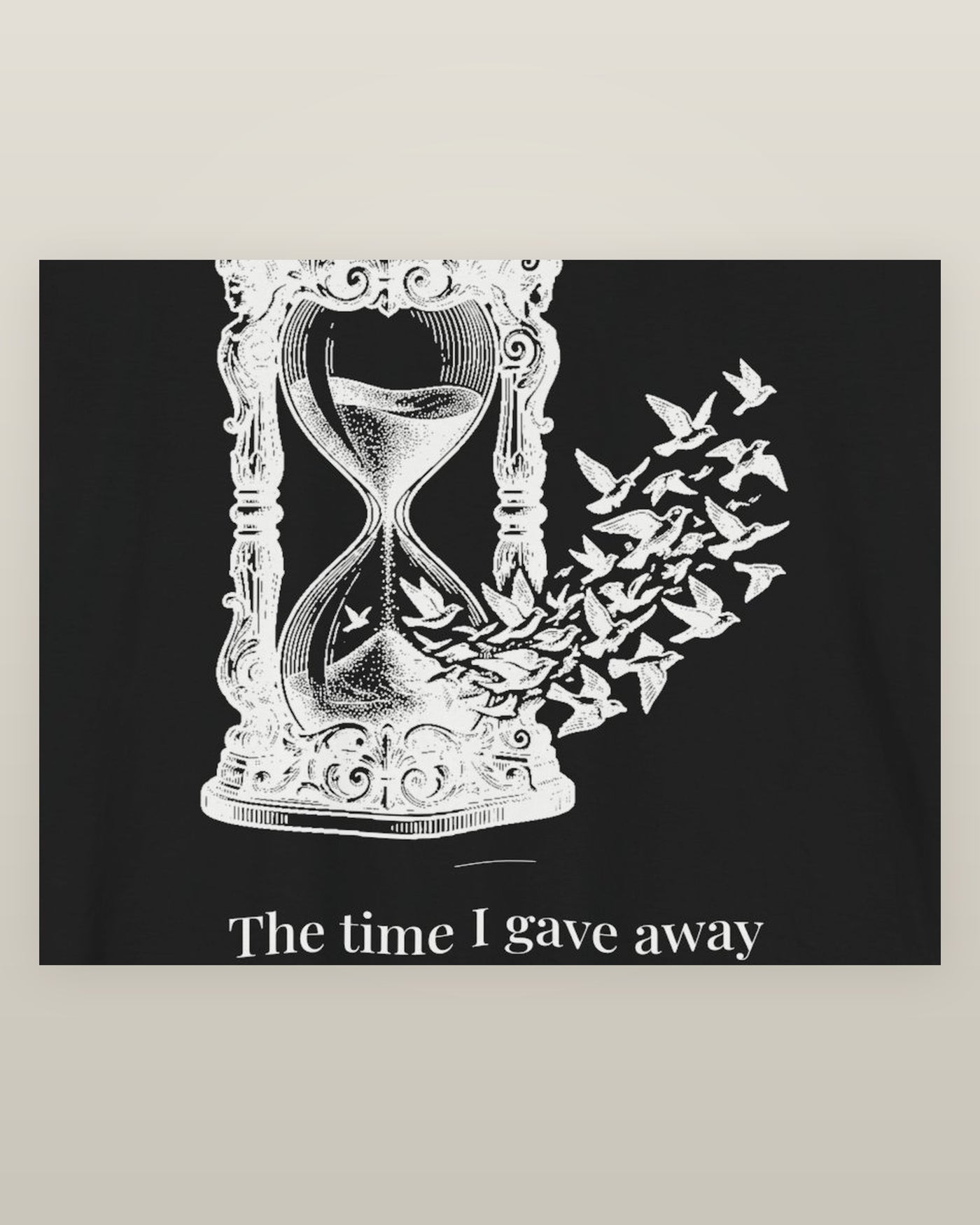 The time I gave away — an hourglass whose falling sand becomes a flock of birds, printed on a black cotton t-shirt, close detail of the print
