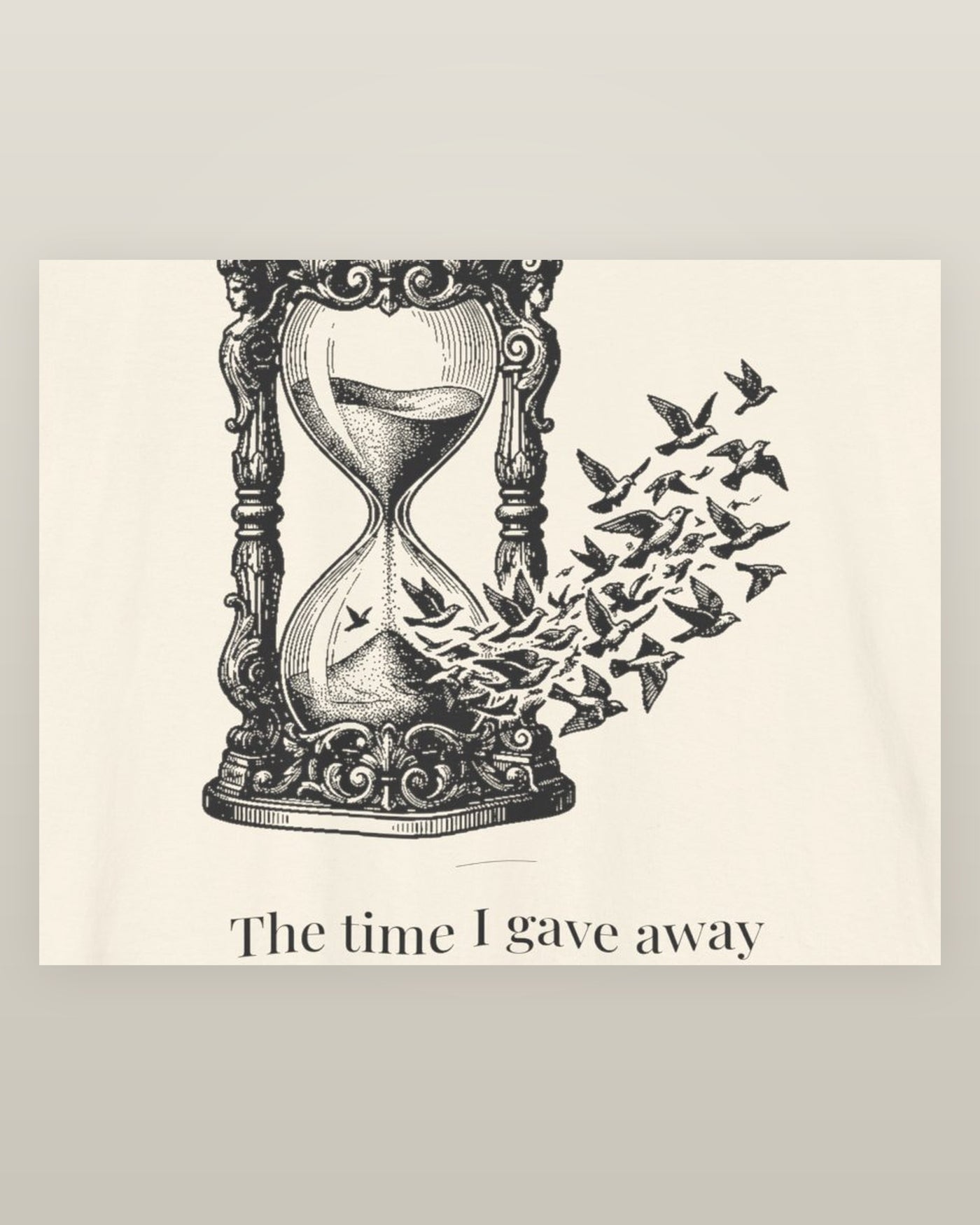 The time I gave away — an hourglass whose falling sand becomes a flock of birds, printed on a natural cream cotton t-shirt, close detail of the print