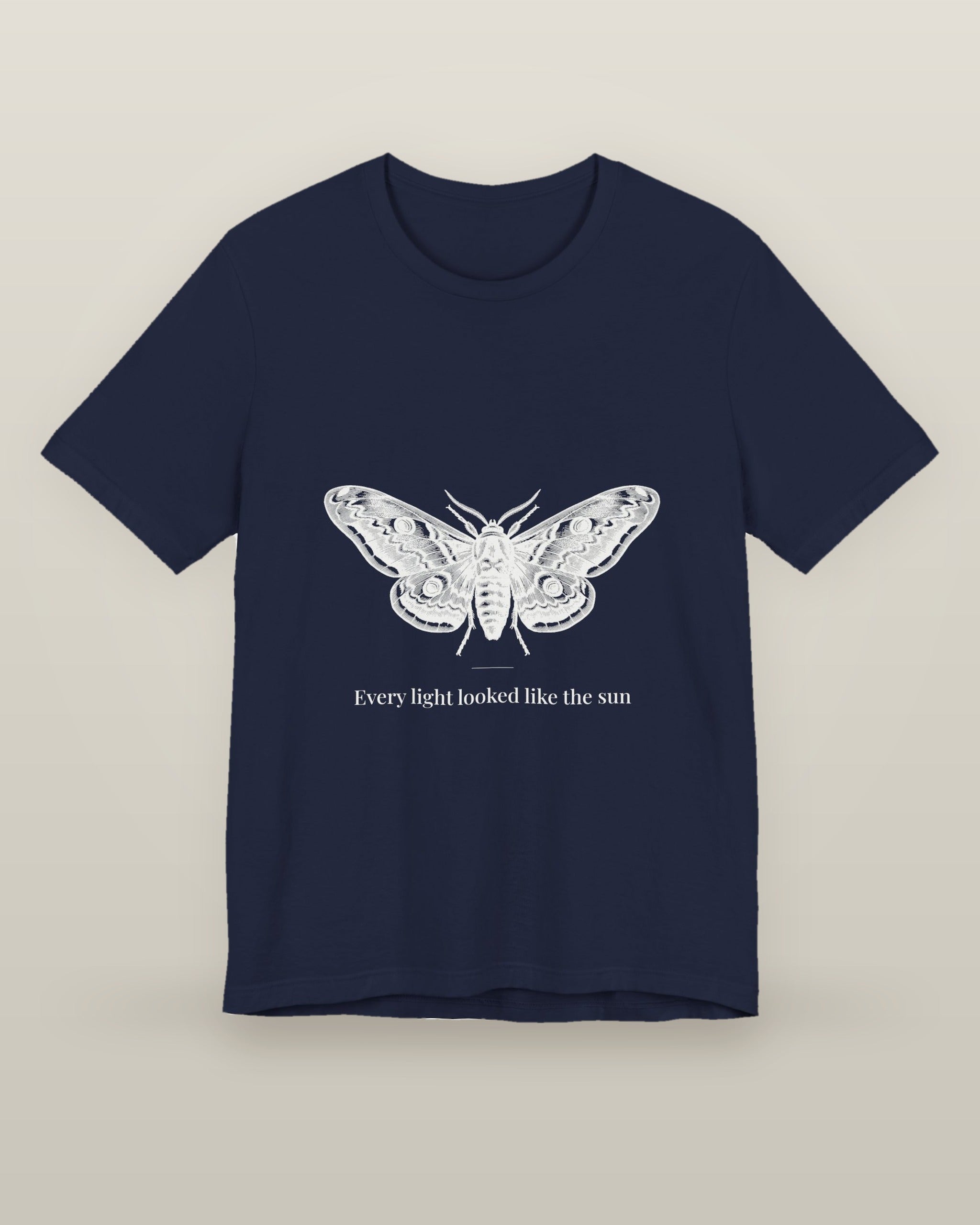 Every light looked like the sun — a moth specimen study, wings spread, printed on a navy cotton t-shirt, front view