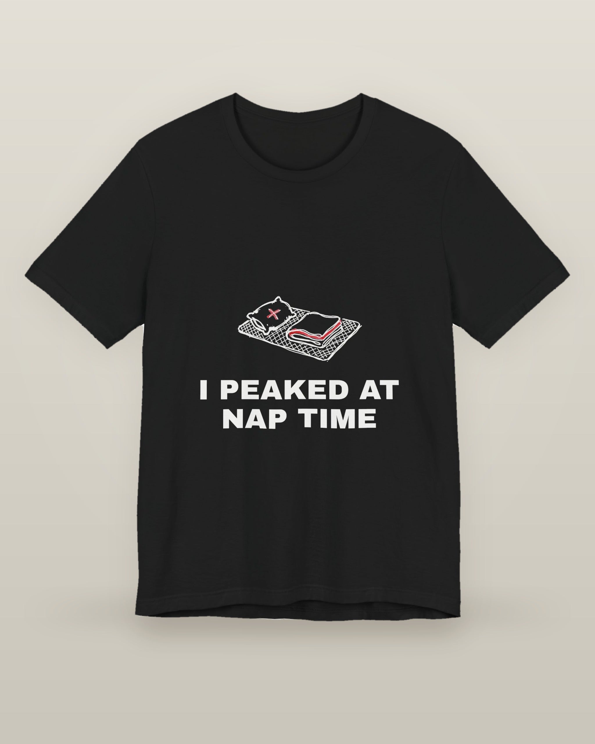 I peaked at nap time — a floor nap mat with a folded blanket and one pillow, printed on a black cotton t-shirt, front view