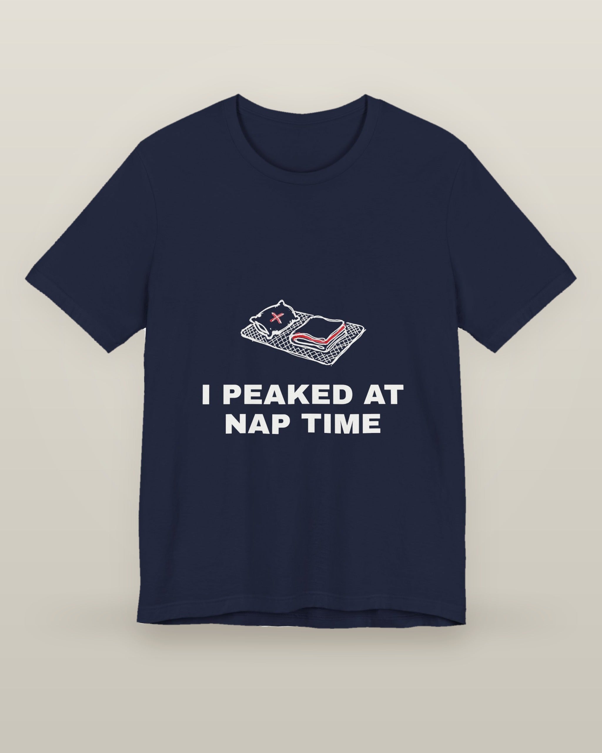I peaked at nap time — a floor nap mat with a folded blanket and one pillow, printed on a navy cotton t-shirt, front view